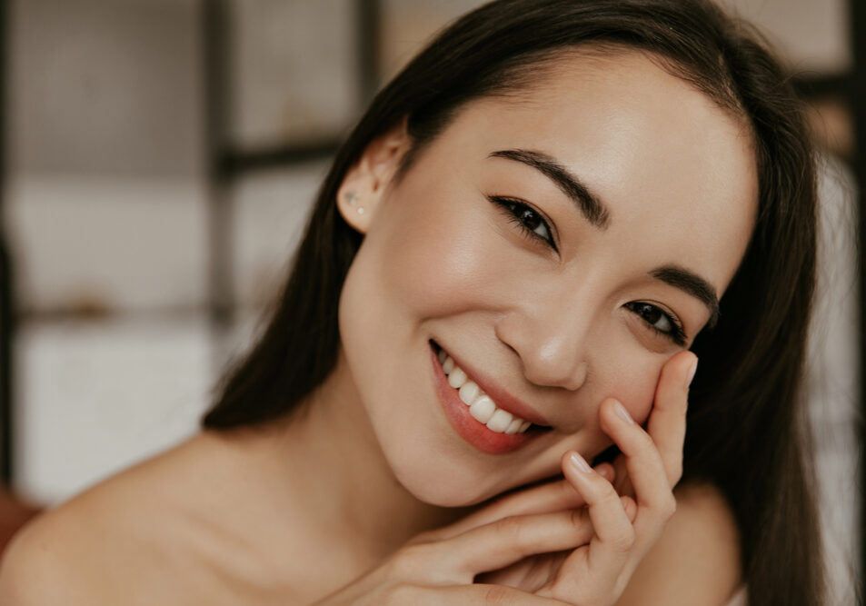 Happy,Young,Woman,Smiles,Sincerely.,Attractive,Brunette,Asian,Lady,Touches