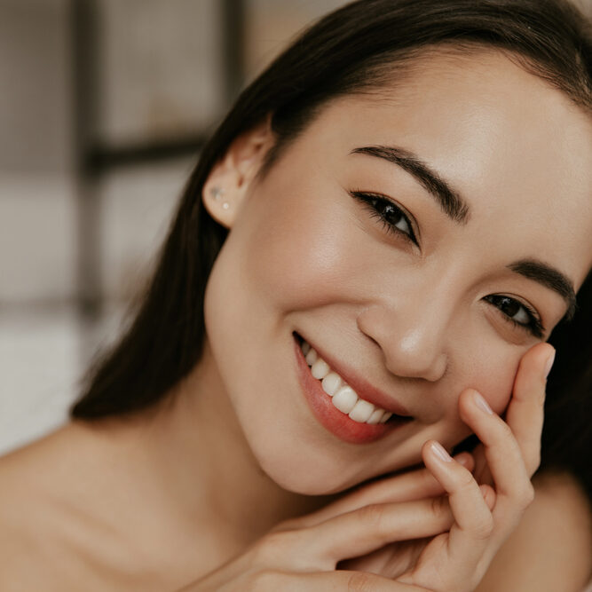 Happy,Young,Woman,Smiles,Sincerely.,Attractive,Brunette,Asian,Lady,Touches